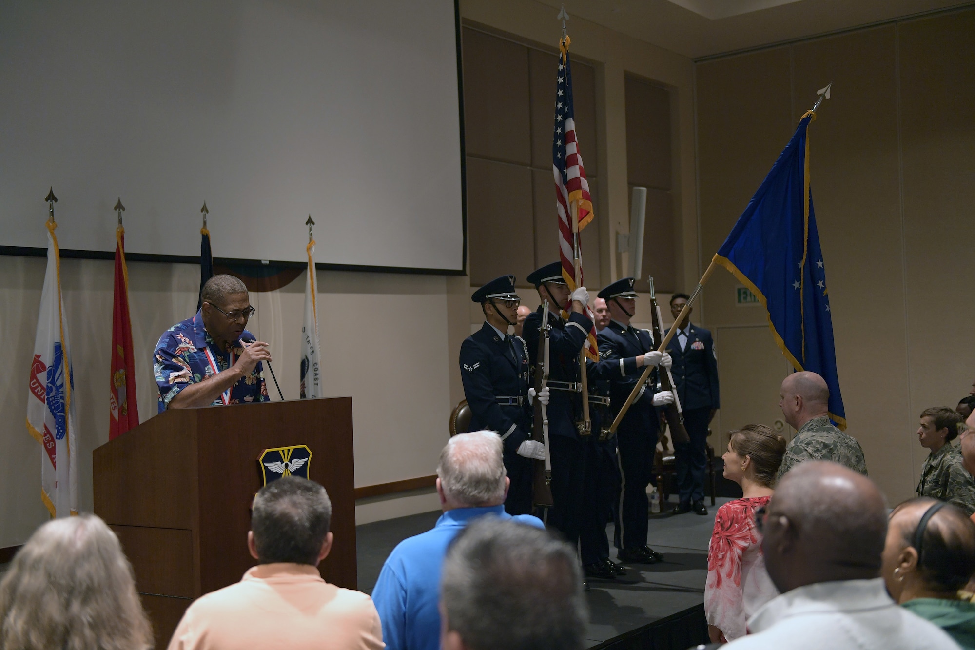 Ivan Taylor, far left, performs the singing of the National Anthem during the official portion of the Retiree Appreciation Day event at Buckley Air Force Base, Colorado, Aug. 25, 2018.