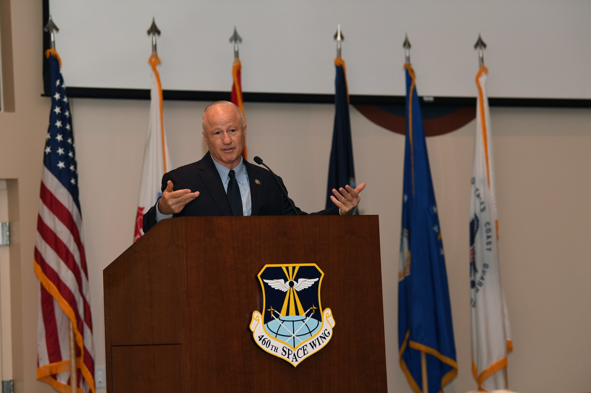 Congressman Mike Coffman, U.S. Representative for Colorado's 6th congressional district, shares his history of service then addresses concerns from the audience during the Retiree Appreciation Day event at Buckley Air Force Base, Colorado, Aug. 25, 2018.