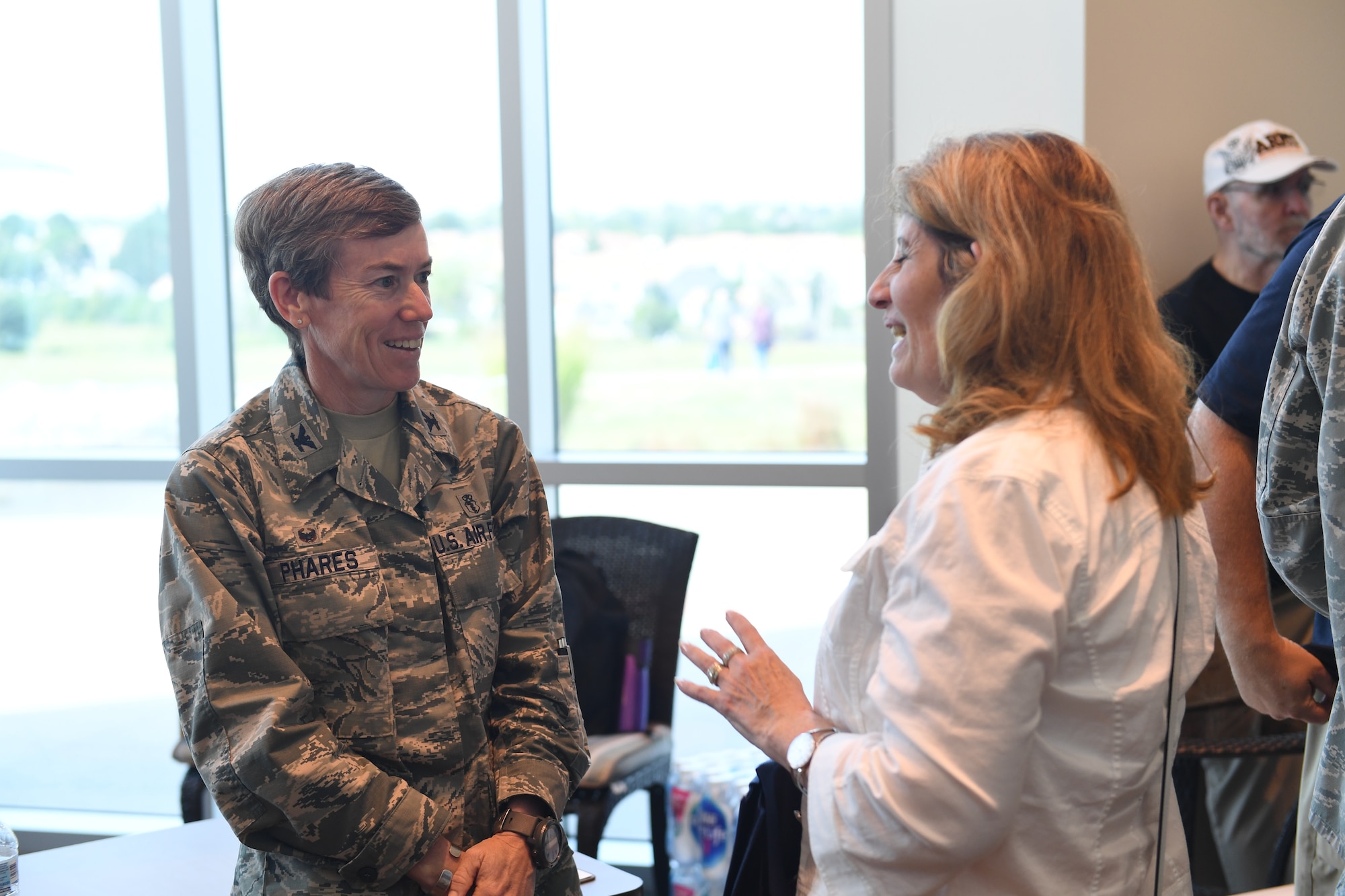 Col. Shannon Phares, 460th Medical Group commander, speaks to an attendee of the Retiree Appreciation Day event at Buckley Air Force Base, Colorado, Aug. 25, 2018.