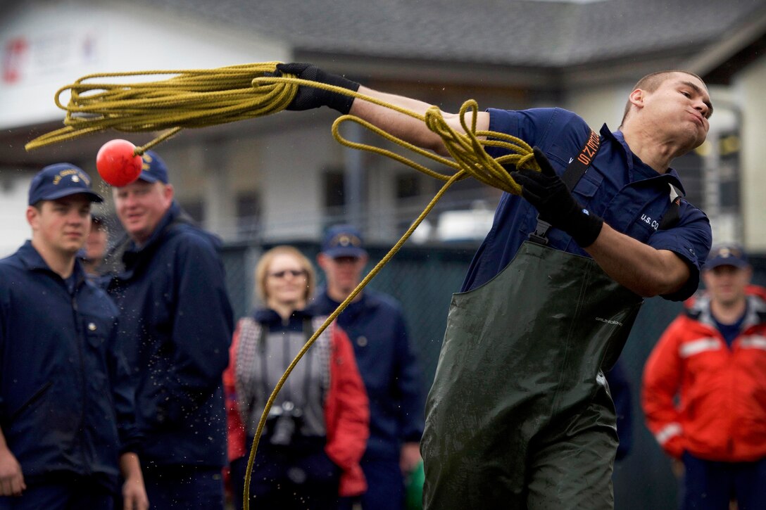 A Coast Guardsman competes in the heaving line toss.