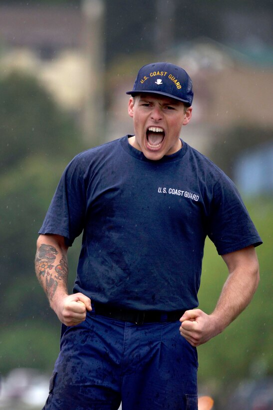 A Coast Guardsman yells in excitement after taking first place in the tug-o-war competition.