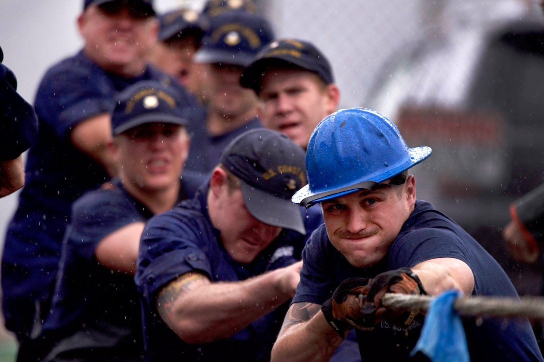 Coast Guardsmen compete in the tug-of-war event.