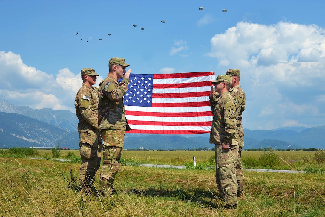 A paratrooper swears the oath of reenlistment during airborne operation.