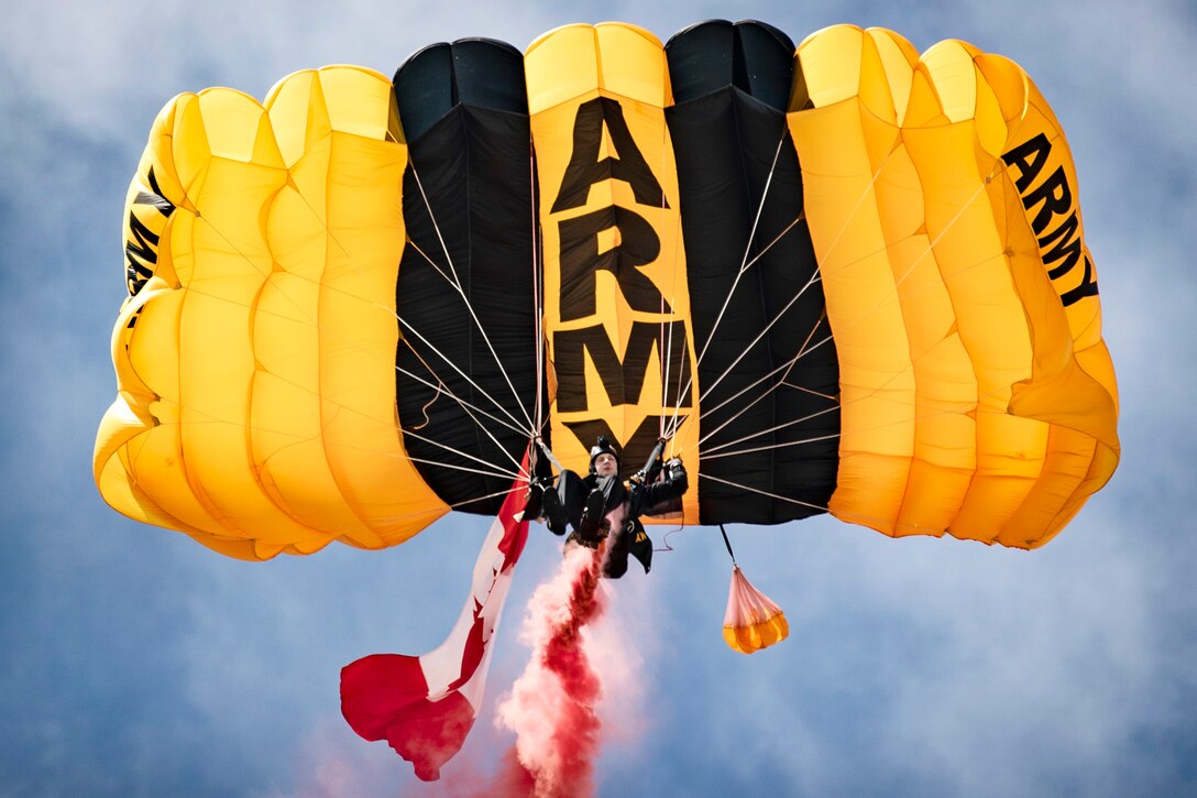 A soldier with the U.S. Army Golden Knights Parachute Team prepares to land.