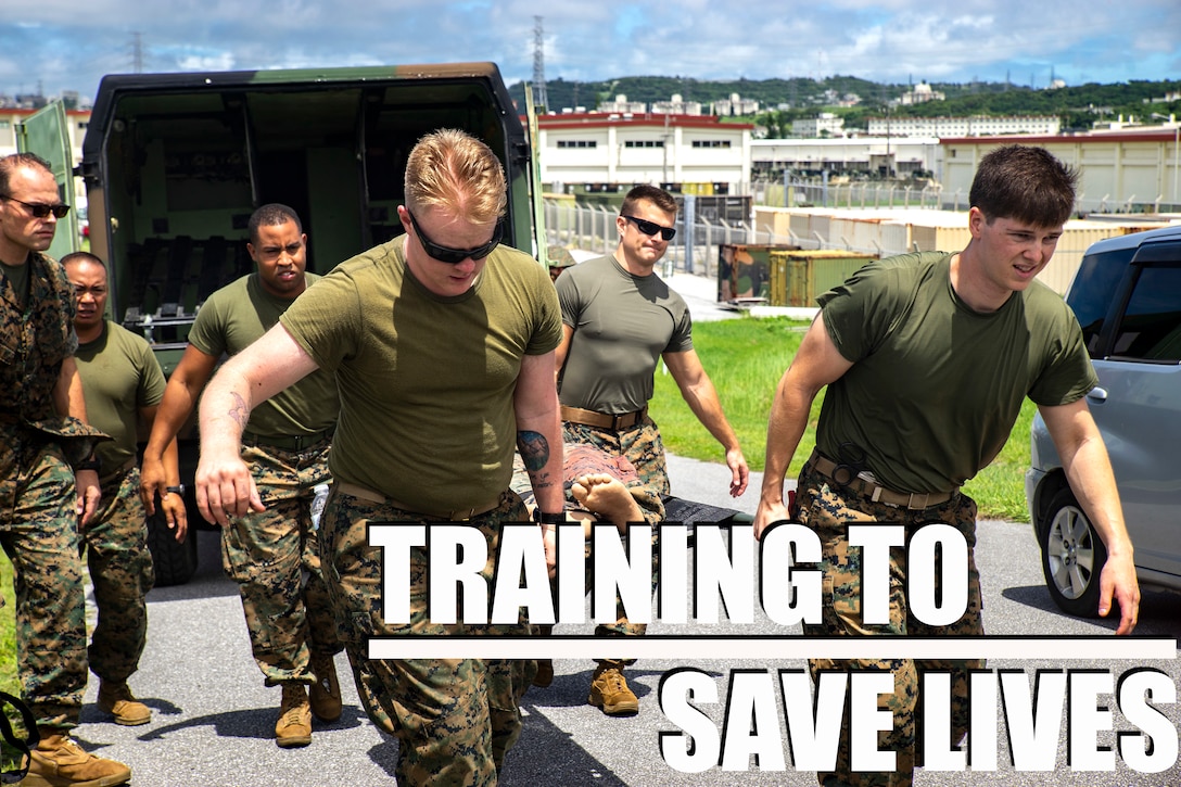 Medical personnel assigned to 3rd Medical Battalion, 3rd Marine Logistics Group, escort a simulated casualty during a Navy Medicine Augmentation Program pre-deployment training at Medical Simulation Training Center South, Okinawa, Japan, Aug. 25, 2018.  (U.S. Marine Corps photo by Cpl. Joshua Pinkney)