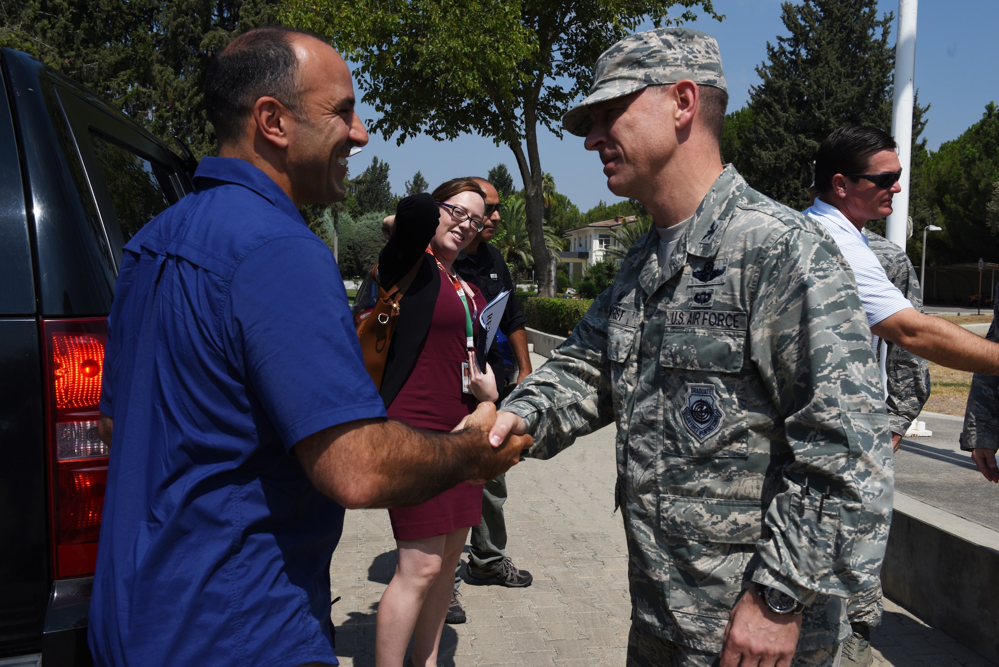 Air Base Wing Commander greets Rep. Jimmy Panetta.