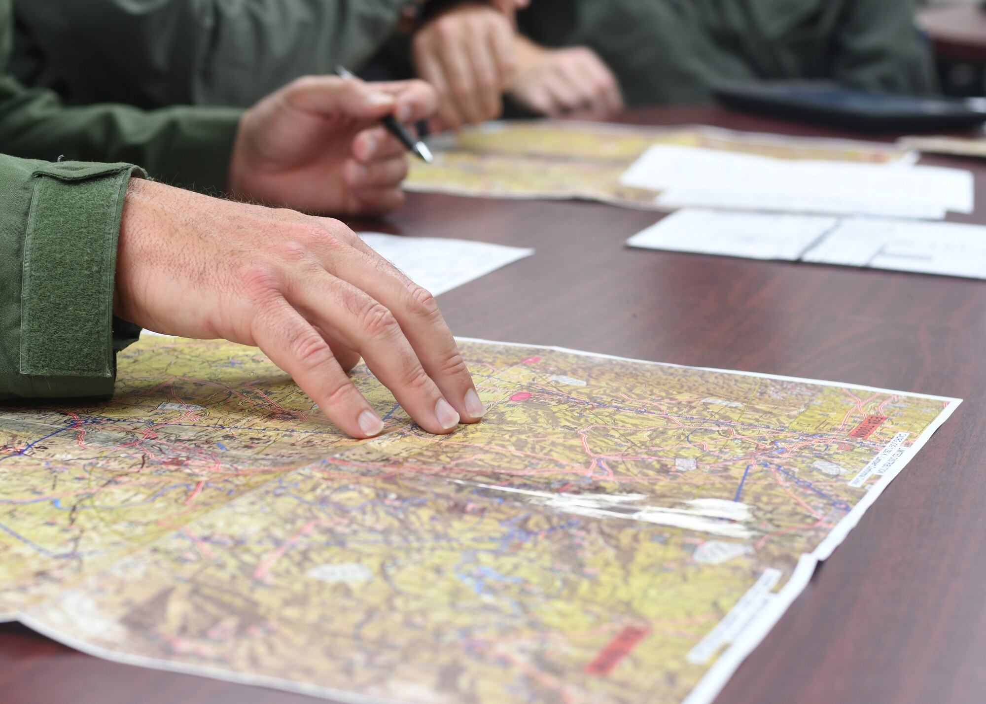 Aircrew members with the 700th Aerial Squadron plan for their next flight at Youngstown Air Reserve Station, Aug. 7, 2018. A crew from the 700th AS, flying a C-130H3 Hercules attended Tac Week training at YARS to practice and apply tactical airlift operations as well as train in a group with other units. (U.S. Air Force photo by Staff Sgt. Miles Wilson)