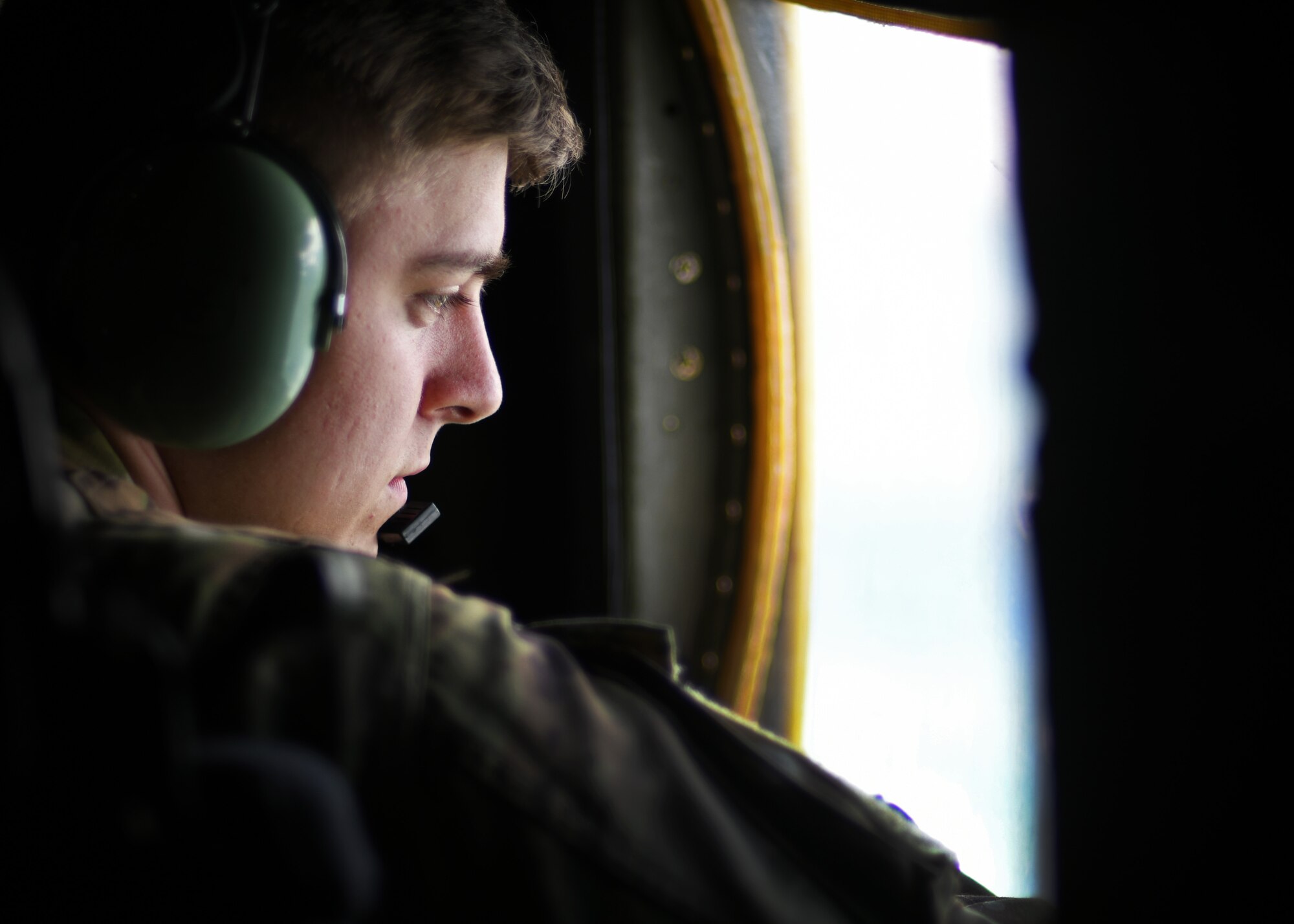 Senior Airman Trevor Armentrout, 700th Aerial Squadron loadmaster, scans outside of the aircraft for any discrepencies at Youngstown Air Reserve Station, Ohio, Aug. 6, 2018. Armentrout participated in Tac Week, a training hosted by the 910th Airlift Wing, where the 700th AS trained with the 908th AS and the 757th AS. (U.S. Air Force photo by Staff Sgt. Miles Wilson)