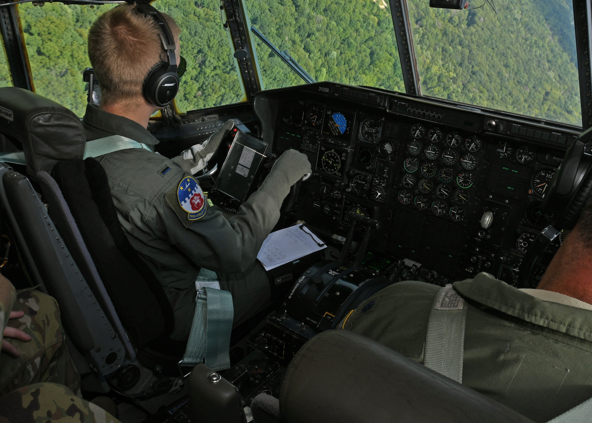 1st Lt. Harry Downing, 700th Aerial Squadron pilot, performs evasive aerial maneuvers in a C-130H3 Hercules outside of Youngstown Air Reserve Station, Ohio, Aug. 6, 2018. Downing, and the other aircrew members aboard, attended Tac Week training, hosted by the 910th Airlift Wing. The training involved the 908th AS and the 757th AS and consisted of various tactical scenarios and competitions between the squadrons. (U.S. Air Force photo by Staff Sgt. Miles Wilson)