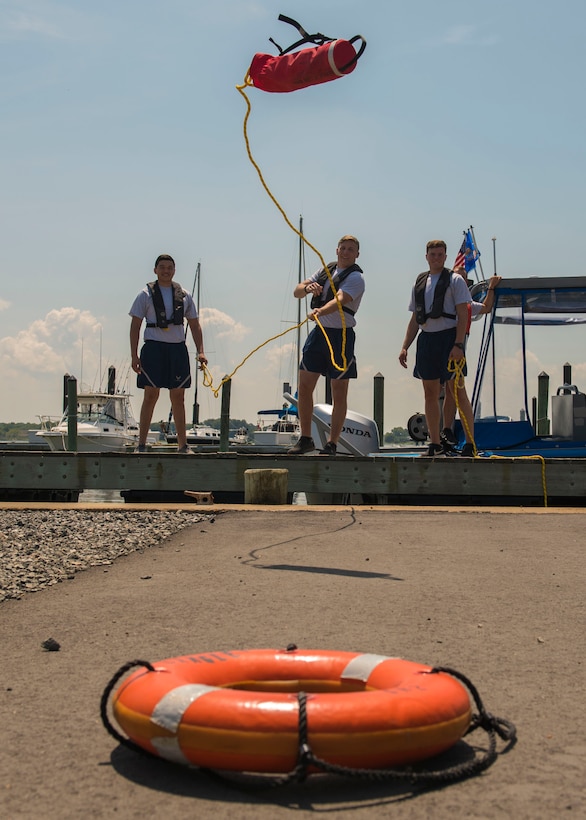 U.S. Air Force Airmen assigned to the 633rd Security Forces Squadron toss a rope at Joint Base Langley-Eustis, Virginia, Aug. 15, 2018.