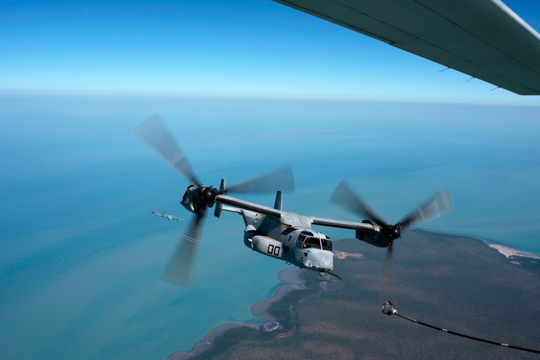 U.S. Marines pilot a KC-130 Hercules aircraft from Marine Aerial Refueler Transport Squadron 152, over Northern Territory, Australia, Aug. 17, 2018. Two C130s from VMGR-152 took part in aerial refueling of MV-22 Osprey as part of the Osprey pilots’ recertification process during Marine Rotational Force – Darwin 18.
