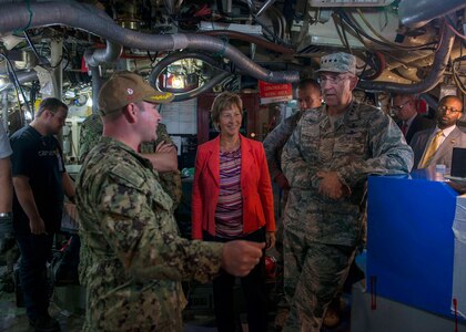 U.S. Navy Cmdr. William Filip, left, Gold crew commanding officer of the Ohio-class ballistic missile submarine USS Alabama (SSBN 731), give U.S. Air Force Gen. John E. Hyten, right, commander of U.S. Strategic Command (USSTRATCOM), and his wife Laura, center, a tour of Alabama following the Omaha Trophy presentation at Naval Base Kitsap-Bangor.  Alabama, the 2017 SSBN Omaha Trophy recipient, is one of eight ballistic-missile submarines stationed at Naval Base Kitsap-Bangor providing the most survivable leg of the strategic deterrence triad for the United States.