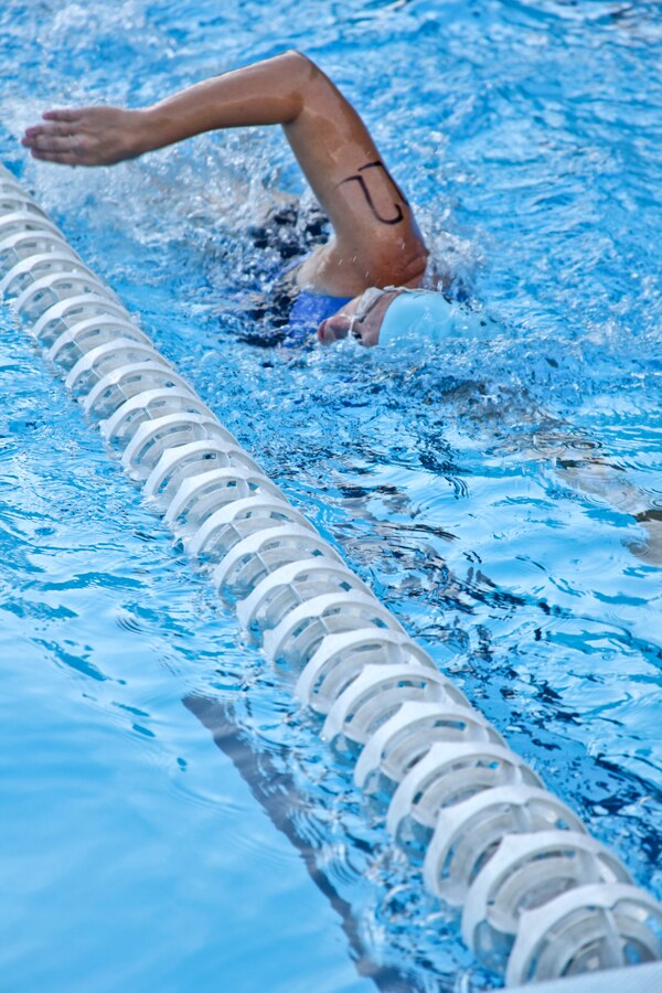 Susan Donovan competes in the pool portion for the 19 and below age group during the Marine Corps Community Services’ 19th annual Sprint Triathlon Relay at Marine Corps Air Station Cherry Point, N.C., Aug. 18, 2018. Around 80 participants, including services members and their families from the local community and surrounding area, took part in a 400-meter swim, 10-mile bike ride and a 3-mile run. Athletes braved soaring temperatures and stiff competition in the grueling, but popular event. (U.S. Marine Corps photo by Lance Cpl. Alexandra Santos Arambulo)