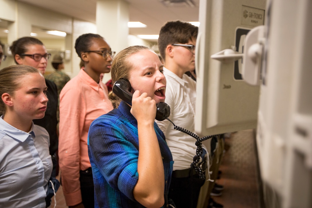 New recruits of Delta Company, 1st Recruit Training Battalion, and Papa Company, 4th Recruit Training Battalion, make a phone call home to inform family or friends that they have arrived safely on Parris Island, S.C., for recruit training July 16, 2018. Each recruit will get in contact with either their next-of-kin, or their recruiter upon arrival on the depot.