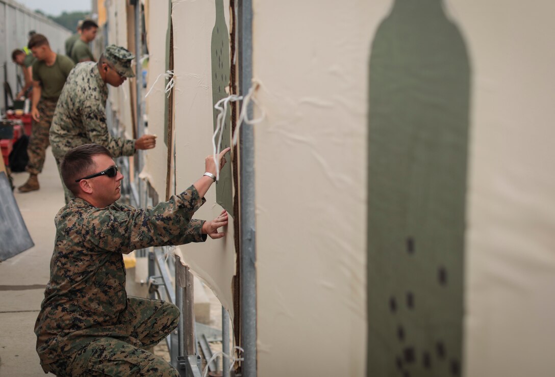 Gunnery Sgt. Josh Heckman, the Marine Corps Recruit Depot Parris Island Shooting Team’s armorer, pulls pits with the team during the Infantry Trophy Team Match at Camp Perry, Ohio Aug. 2, 2018. Joy served as a spotter and coach for the team during the match, directing lines of fire and making wind calls.