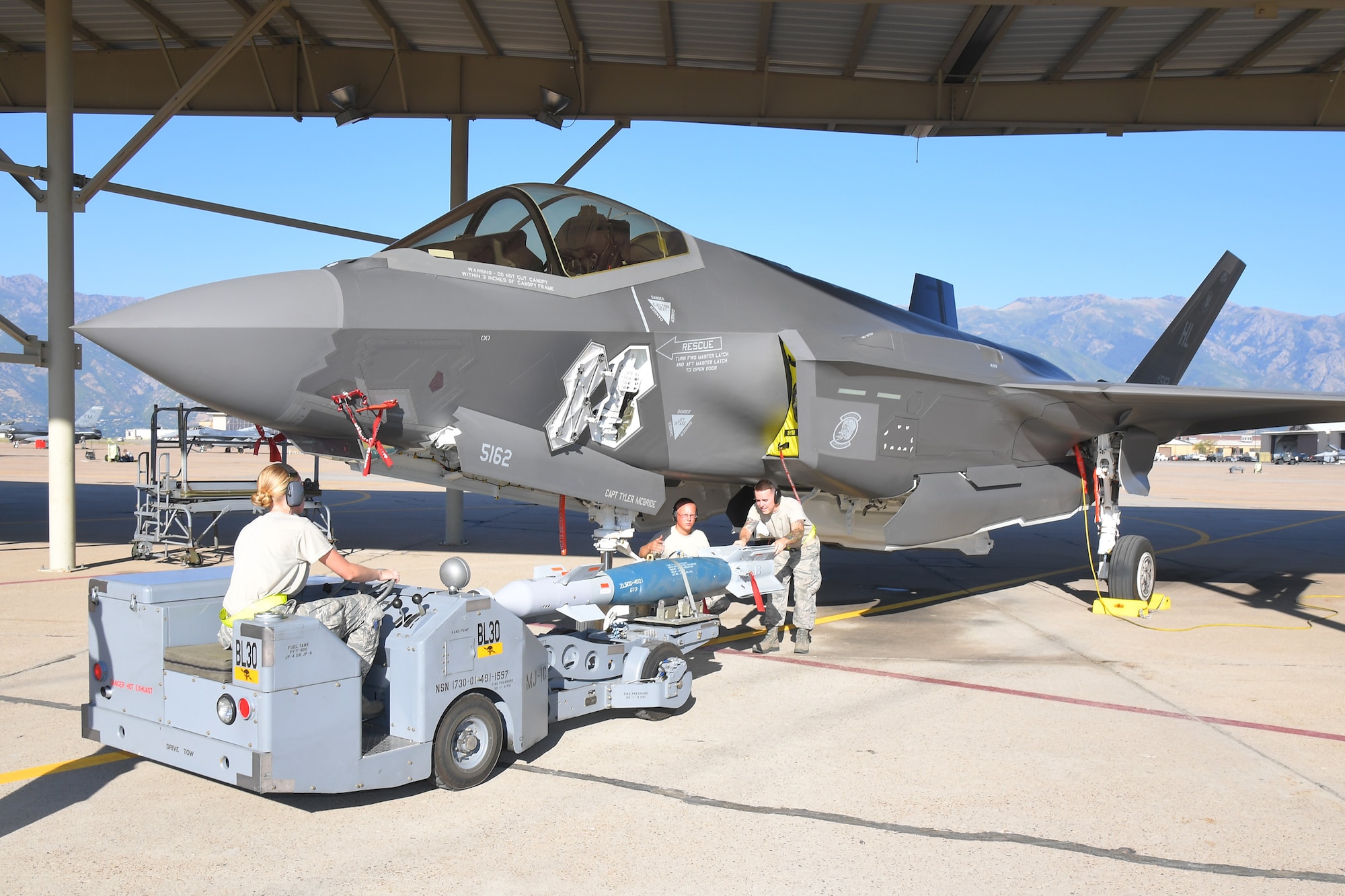 Maintainers from Hill’s fighter wings load target munitions on an F-35 Lightning II during exercise Combat Hammer Aug. 8, 2018, at Hill Air Force Base, Utah.