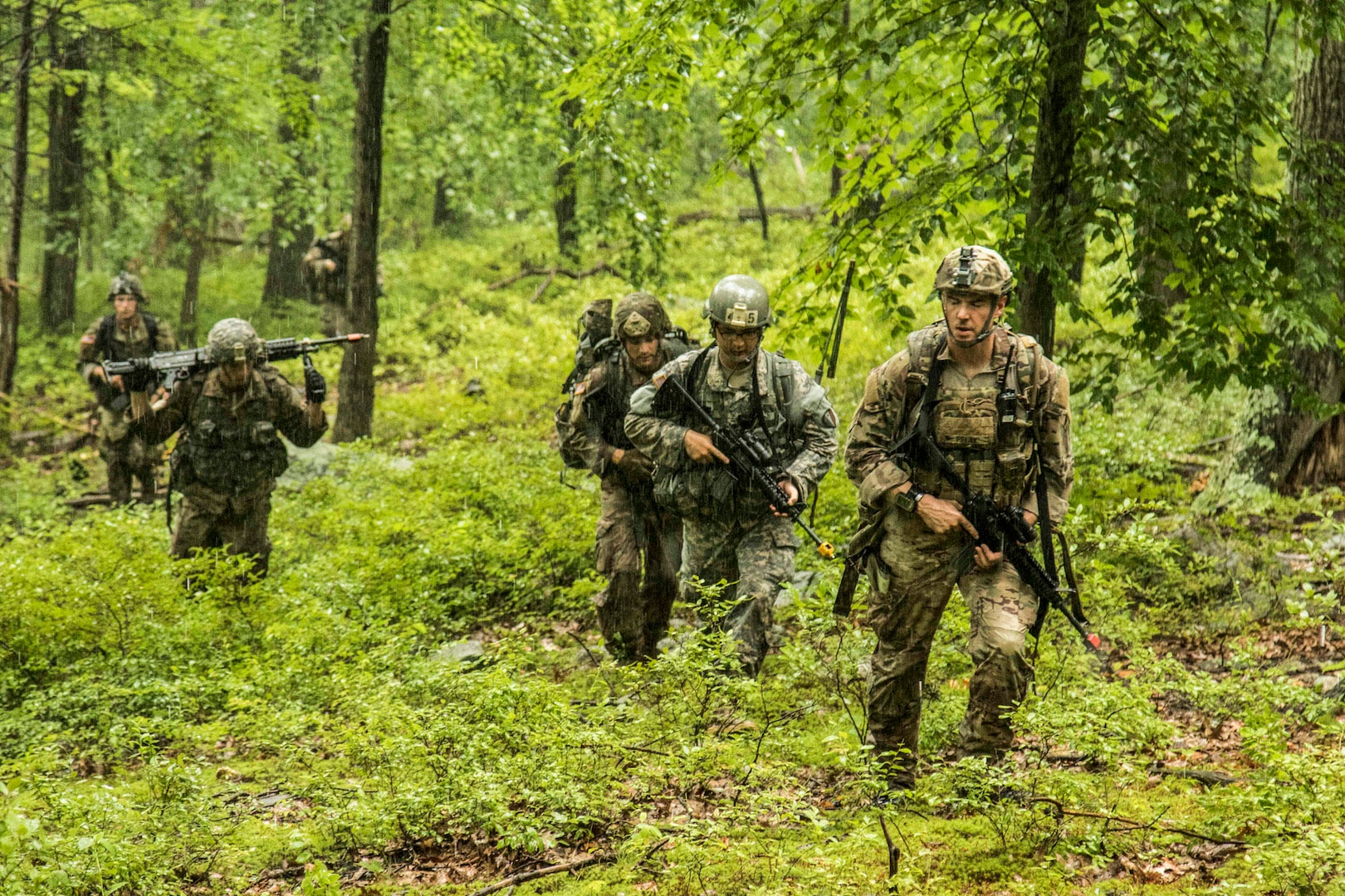 Army National Guard Soldiers from the Northeast Region at infantry reclassification course 18-002  ruck march in the mountains during their final field training exercise at Camp Smith Training Site, Cortlandt Manor, N.Y., Aug. 13, 2018. The 106th Regional Training Institute conducted the infantry course from August 3-21, 2018 and adapted the training curriculum to meet the new infantry standards.
