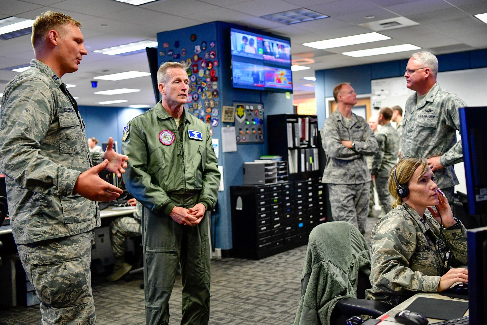 Capt. Jake Allenton, 225th Air Defense Squadron senior director, answers Gen. Terrence O'Shaughnessy, NORAD and USNORTHCOM commander, questions during his visit to the Western Air Defense Sector, Joint Base Lewis-McChord, Washington Aug. 23, 2018.  O'Shaughnessy received a tour of the operations floor and met with the WADS crew that provided command and control of the 142nd Fighter Wing's F-15 intercept of the Aug. 10 stolen Horizon Bombardier Q400 aircraft out of SeaTac International Airport. (U.S. Air National Guard photo by Maj. Kimberly D. Burke)