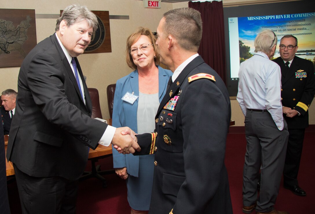 Col. Mike Derosier, U.S. Army Corps of Engineers Vicksburg District commander, and Mississippi River Commission members, speak with partners and concerned citizens before the annual low-water inspection public hearing in Vicksburg, Mississippi, Aug. 22, 2018.