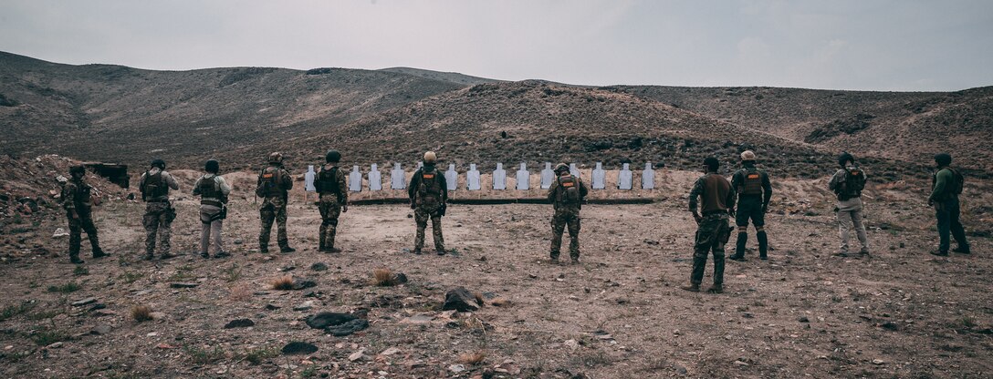 Police officers with the Carson City Special Weapons and Tactics (SWAT) team face up range before conducting the Marine Corps Pistol Qualification at a training area in Hawthorne, Nev., Aug 2, 2018. The purpose of this training was for Marine Corps Forces Special Operations Command Marines and Carson City SWAT to exchange knowledge and tactics to improve not only the Marines’ war fighting lethality, but also for the SWAT team to improve their tactics for specialized domestic incidents. (U.S. Marine Corps photo by Lance Cpl. William Chockey)