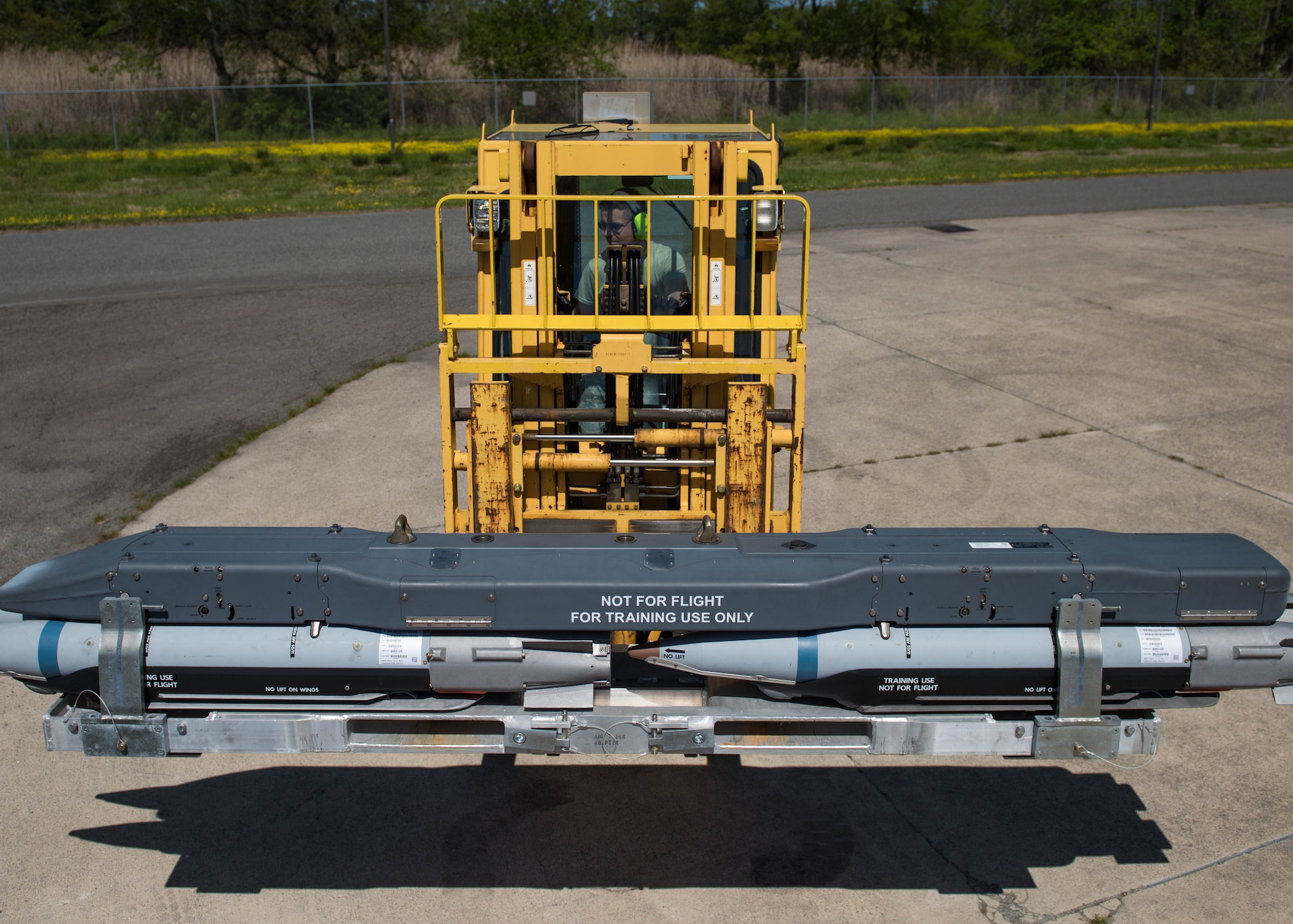 U.S. Air Force Airman 1st Class Ulysses Rodriguez, 1st Maintenance Squadron conventional maintenance technician, picks up GBU39A/B’s with a forklift at Joint Base Langley-Eustis, Virginia, May 1, 2018.