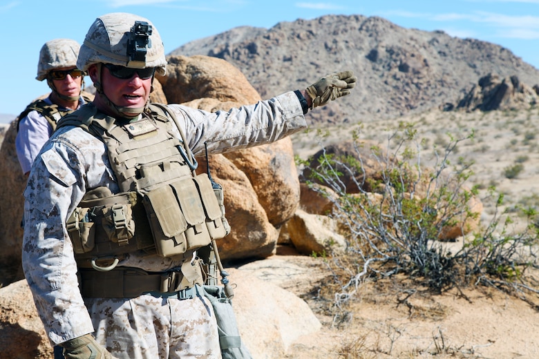 LtCol Jimmy Birchfield, Commanding Officer, 3rd Battalion, 4th Marines, 7th Marine Regiment, describes the action taking place during India Company, 3/4’s live-fire training evolution in the Galway Lake Training Area in the Johnson Valley Exclusive Military Use Area, Marine Corps Air Ground Combat Center, Twentynine Palms, Calif., Aug. 24, 2018. (Marine Corps photo by Kelly O'Sullivan)