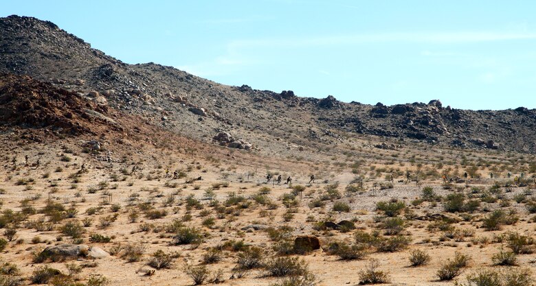 Members of India Company, 3rd Battalion, 4th Marines, 7th Marine Regiment, advance toward their first objective during live-fire training in the Galway Lake Training Area in the Johnson Valley Exclusive Military Use Area, Marine Corps Air Ground Combat Center, Twentynine Palms, Calif., Aug. 24, 2018. (Marine Corps photo by Kelly O'Sullivan)