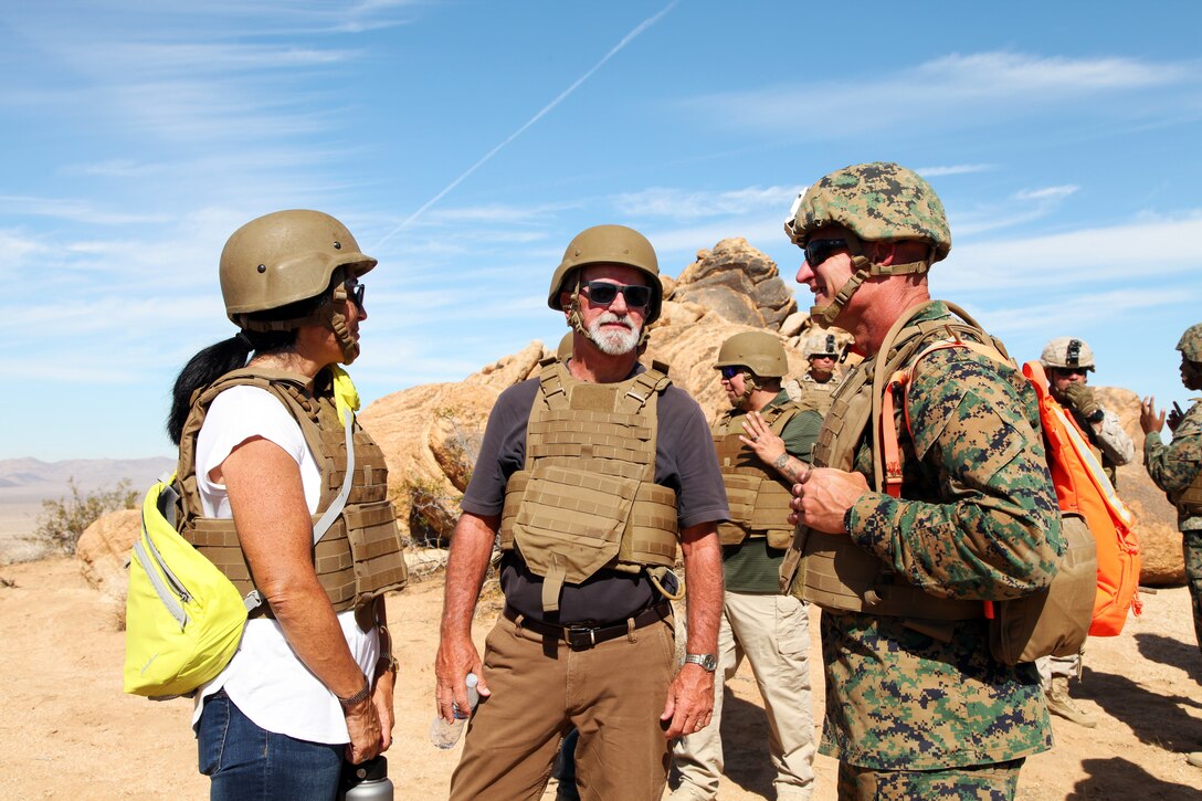 BGen Roger B. Turner, right, talks with Beth Bogue, left, Field Representative for California State Assemblyman Chad Mayes, and Jim Schooler, Field Representative for California State Sen. Jean Fuller, during live-fire training conducted by India Company, 3rd Battalion, 4th Marines, 7th Marine Regiment, in the Galway Lake Training Area in the Johnson Valley Exclusive Military Use Area, Marine Corps Air Ground Combat Center, Twentynine Palms, Calif., Aug. 24, 2018. (Marine Corps photo by Kelly O'Sullivan)