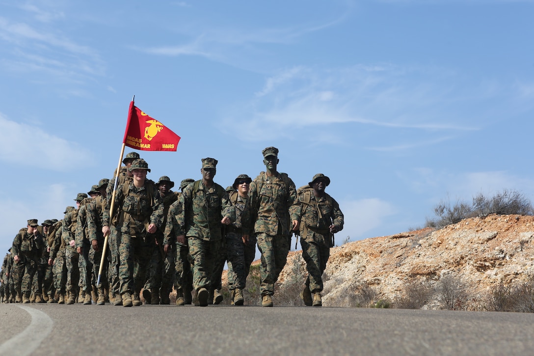 Marines and sailors with Headquarters and Headquarters Squadron hike from main side Marine Corps Air Station Miramar, Calif., to East Miramar Aug. 24. Following the 4.5 mile hike H&HS held a field mess night to honor the legacy of Marines before them and to build camaraderie in the squadron. (U.S. Marine Corps photo by Sgt. Daniel Auvert)