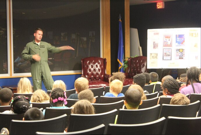 Staff Sgt. Anthony Patton, 15th Airlift Squadron SOLL II evaluator loadmaster, gives a talk to students about the roles loadmasters play on a C-17 during a STEMspiration camp visit Aug. 10, 2018, at Joint Base Charleston, S.C.