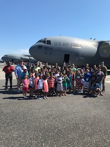 STEMspiration campers pose with members of the 15th Airlift Squadron in front a C-17 Globemaster III they explored during a visit to the flight line at Joint Base Charleston, S.C., Aug. 10, 2018. The camp is sponsored by the Charleston County School District.