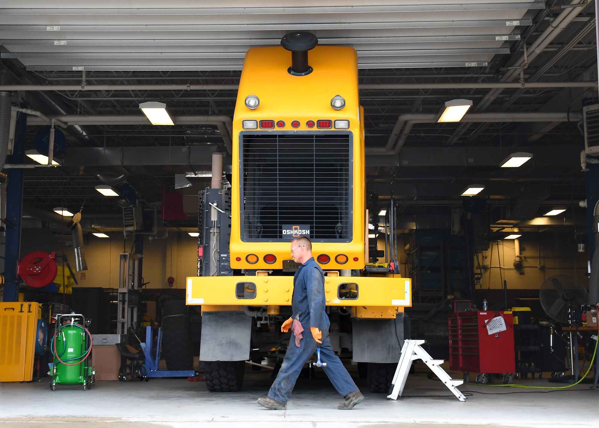Paul Holien, 319th Logistics Readiness Squadron heavy equipment mobile mechanic, prepares to work on a snow plow August 28, 2018, on Grand Forks Air Force Base, North Dakota. The 319 LRS is essential for the maintenance of vehicles to include snow plows on Grand Forks AFB, which are crucial during winter months. Without the assistance of snow plows to keep snow from accruing on the base roads and flightline, normal operations would be impossible. (U.S. Air Force photo by Airman 1st Class Elora J. Martinez)