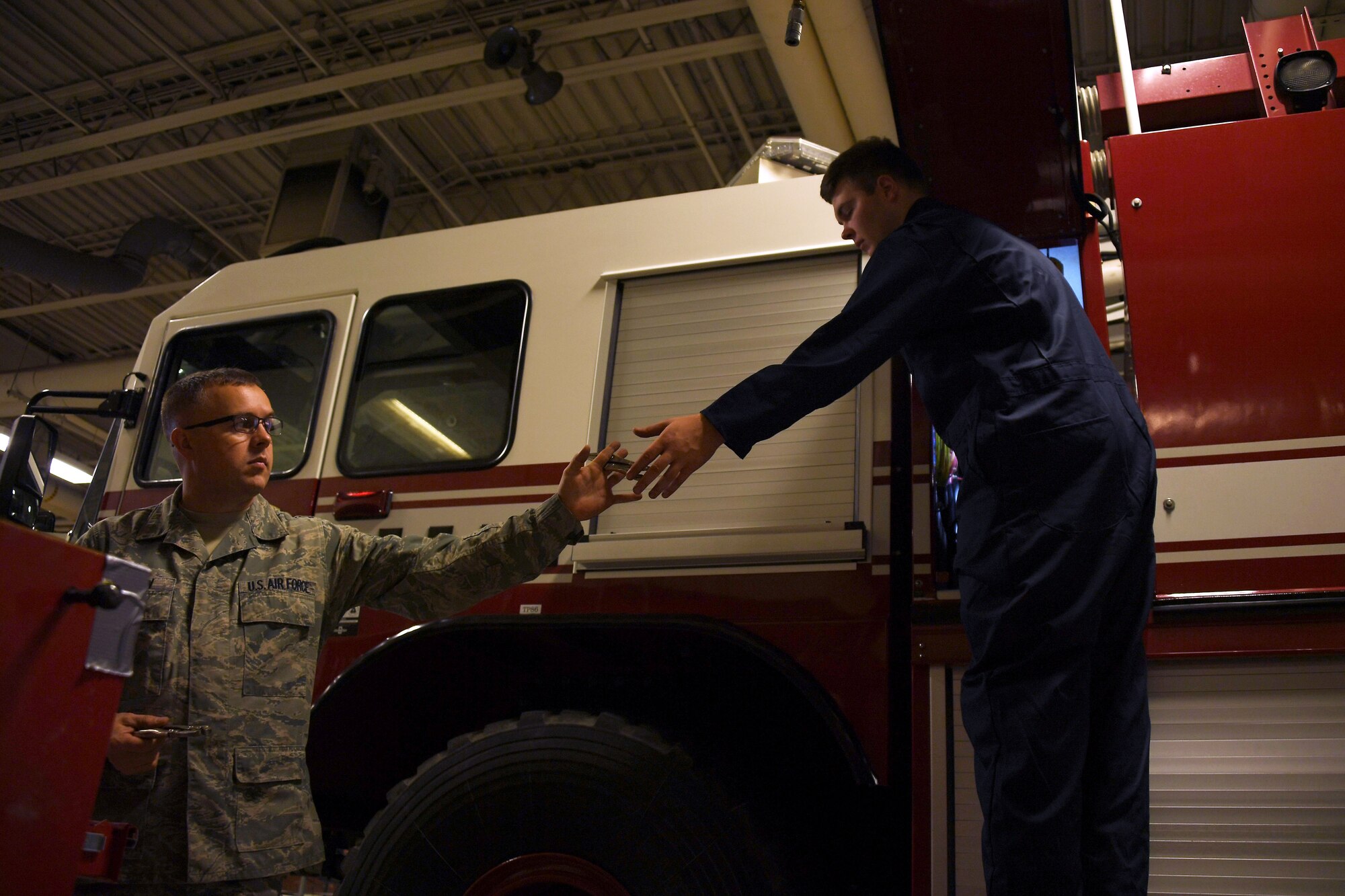 Airman 1st Class Jacob Westafer, 319th Logistics Readiness Squadron fire truck maintenance apprentice, returns a tool to his work station August 28, 2018, on Grand Forks Air Force Base, North Dakota. Westafer attended roughly five months of technical training in order to learn about miscellaneous tools, vehicular pieces and operations, but he says a majority of what he knows now is due to his on-the-job training. (U.S. Air Force photo by Airman 1st Class Elora J. Martinez)