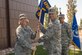 Brig. Gen. DeAnna M. Burt, Air Force Space Command director of operations and communications, presents Lt. Col. Paul W. Contoveros. commander of the 319th Combat Training Squadron, with the 319th CTS guidon.  The 319th CTS is dedicated to advanced training, and the re-designation event marks the continued evolution of this training.  (U.S. Air Force photo by 2Lt Kristen Shimkus)