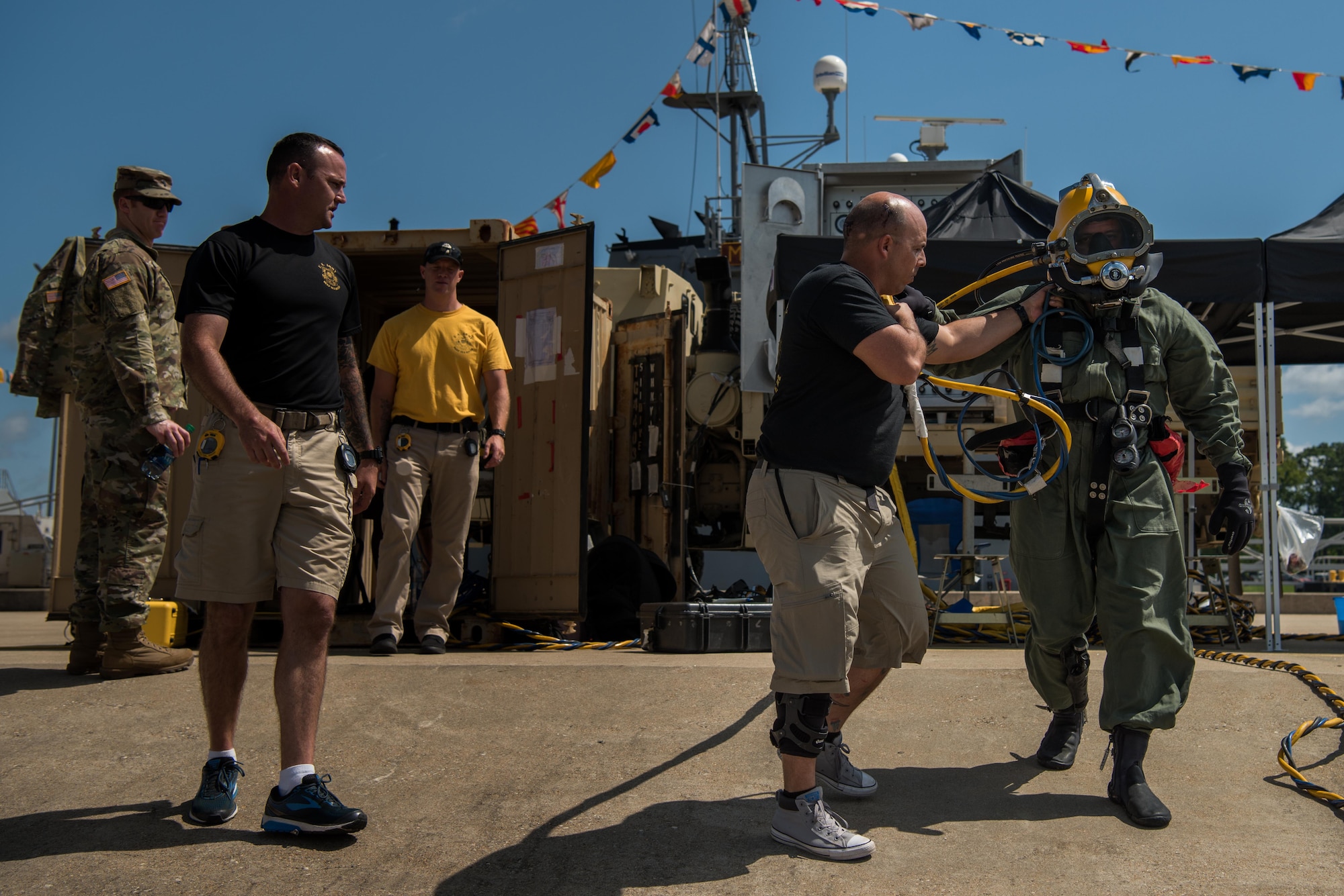 The 511th Engineer Dive Detachment team walks the standby diver to the water during the dive supervisor qualification training scenario at Joint Base Langley-Eustis, Virginia, Aug. 22, 2018.