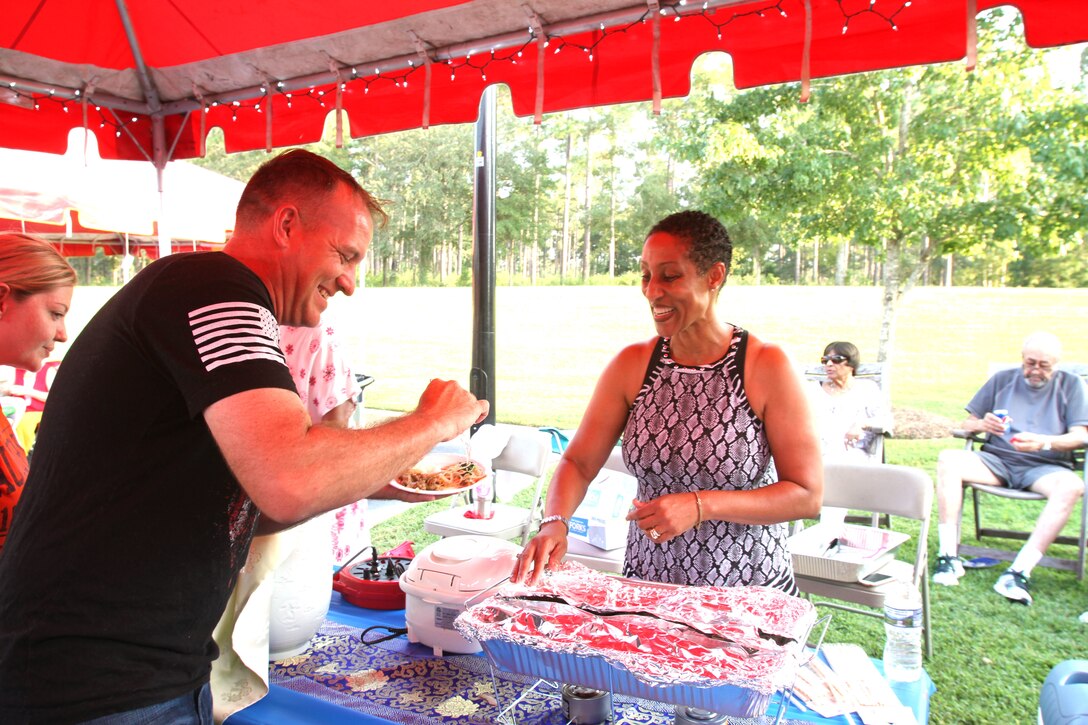 Several active-duty military families held the second annual International Evening under the Stars at Lincoln Military Housing on the base, August 25. The popular event not only unites the community but also shows appreciation for the melting pot of cultures aboard Marine Corps Logistics Base Albany.