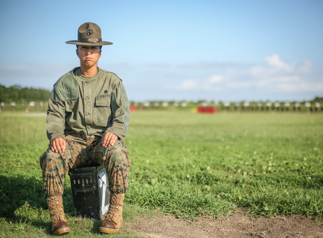 Staff Sgt. Estefania Patino, a Primary Marksmanship Instructor at Marine Corps Recruit Depot Parris Island, S.C., poses for a photo at Hue City Range July 24, 2018.