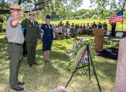 Brig. Gen. Laura Lenderman (right), 502nd Air Base Wing and Joint Base San Antonio commander, and (from left) Lyndon B. Johnson National Historical Park Ranger Patrick Pelarski and , Dave Schafer, chief of Interpretation and Resource Management for the Lyndon B. Johnson National Historical Park, salute the grave of President Lyndon B. Johnson Aug. 27 during a wreath-laying ceremony at LBJ National Historical Park. This year’s event honored what would have been the 110th anniversary of President Johnson’s birth.