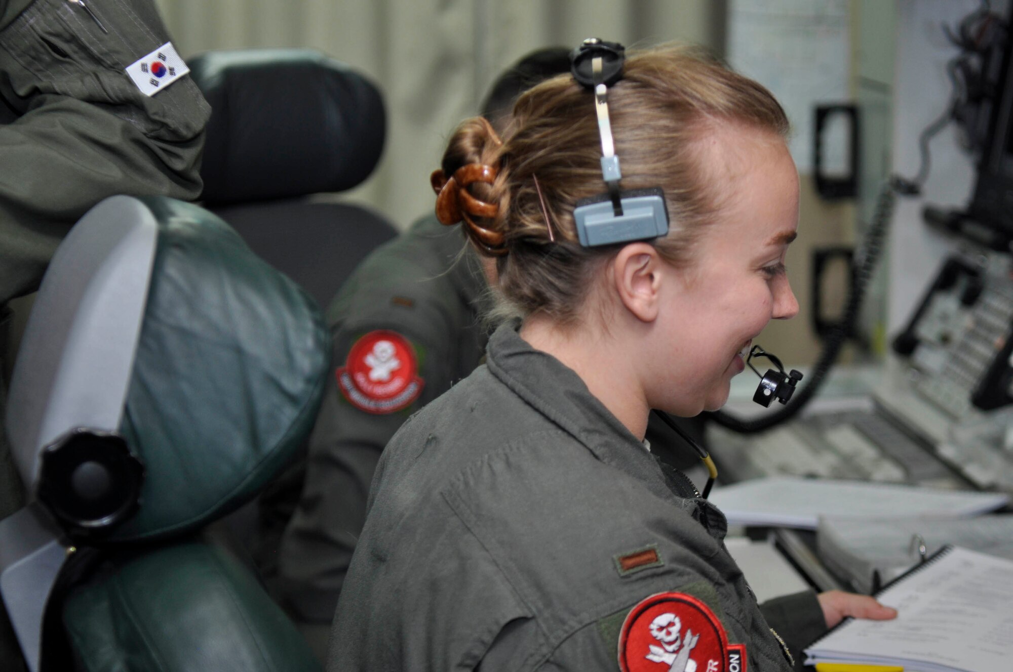 Second Lieutenant Teah Heidorn, 320th Missile Squadron deputy combat crew commander, speaks through her headset to evaluators during a Simulated Electronic Launch-Minuteman test inside a launch control center at a missile alert facility in the 90th Missile Wing missile complex, Aug. 21, 2018. Accomplishing the SELM validates these claims and increases the deterrent capability of the Minuteman III ICBM weapon system. (U.S. Air Force photo by Senior Airman Breanna Carter)