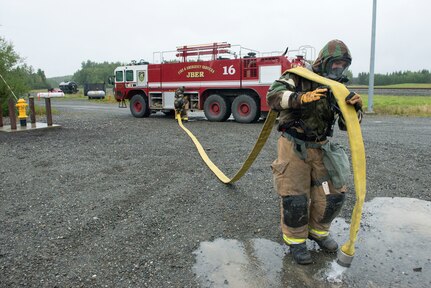 Air Force fire protection specialists conduct wartime-firefighting readiness training at JBER.