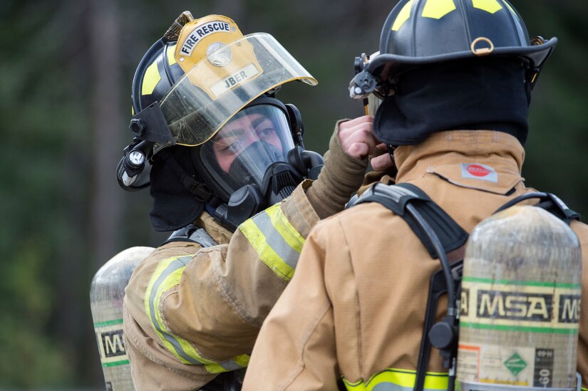 Air Force fire protection specialists conduct wartimefirefighting readiness training at JBER