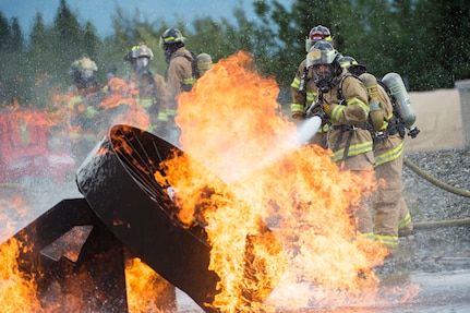 Air Force fire protection specialists conduct wartime-firefighting readiness training at JBER.