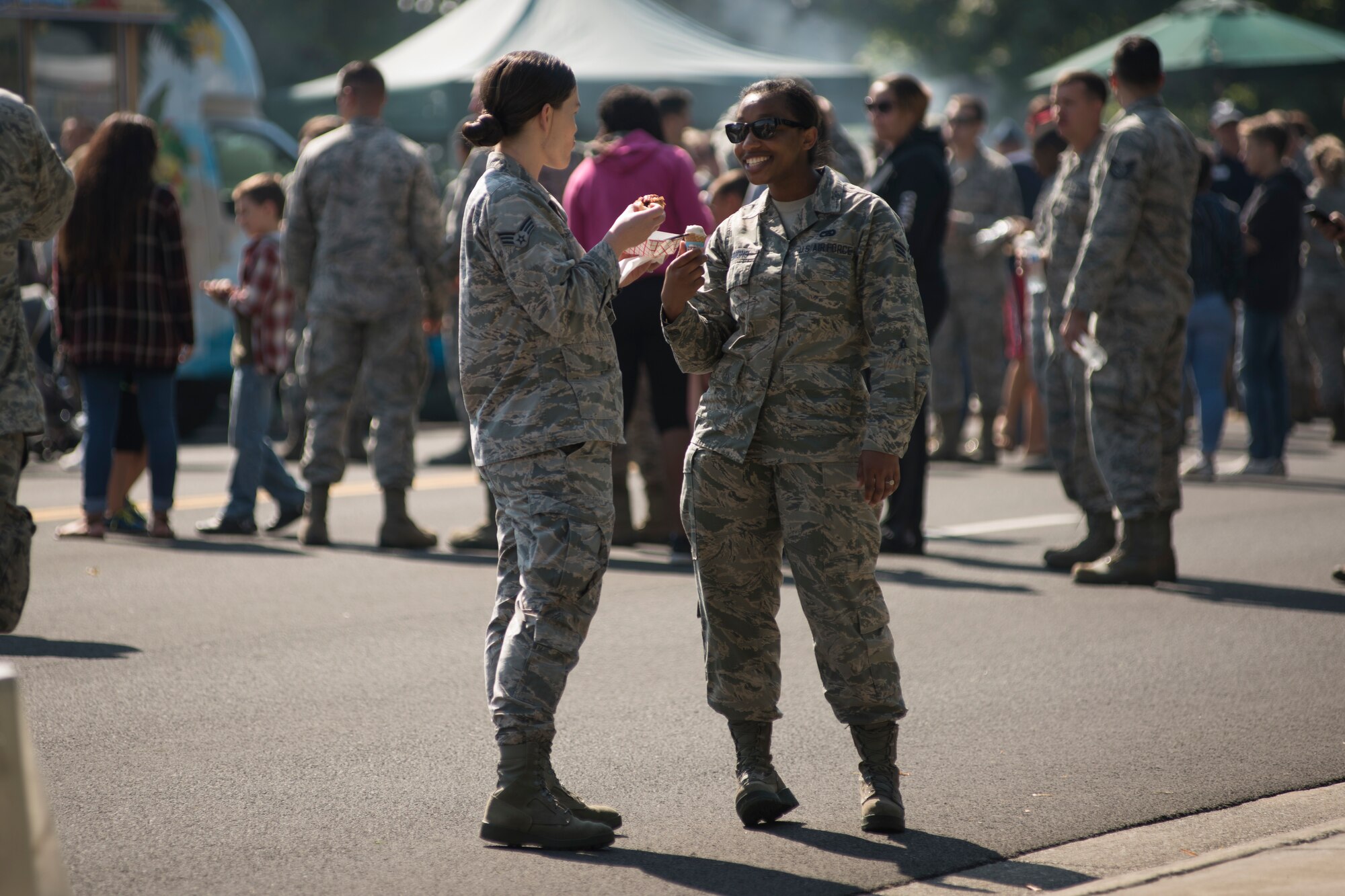 Airmen sample various foods from around the Spokane area at the 2018 Fairchild Food Truck Festival, Aug. 28, 2018, at Fairchild Air Force Base, Washington. Team Fairchild hosted 11 food trucks that provided free samples to Airmen and families. (U.S. Air Force photo/ Senior Airman Ryan Lackey)