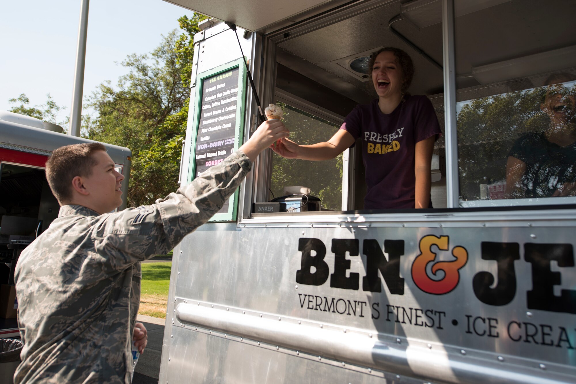 An Airman tries an ice cream sample at the 2018 Fairchild Food Truck Festival, Aug. 28, 2018, at Fairchild Air Force Base, Washington. The food truck festival afforded the chance for Team Fairchild to get a taste of local Spokane food. (U.S. Air Force photo/ Senior Airman Ryan Lackey)