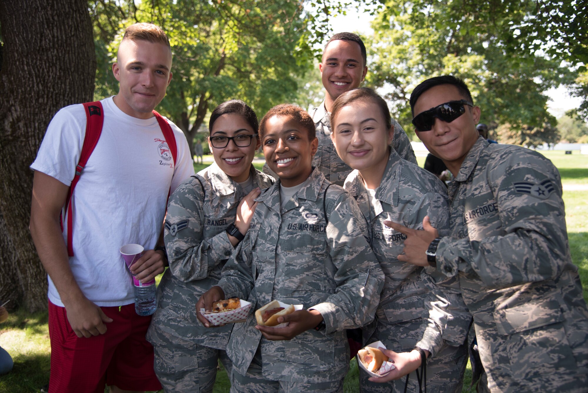 Airmen from the 92nd Comptroller Squadron pose for a group photo at the 2018 Fairchild Food Truck Festival, Aug. 28, 2018, at Fairchild Air Force Base, Washington. The yearly base picnic is typically held at the end of the summer as a way of giving back to hard-working Airmen for the busy summer months. (U.S. Air Force photo/ Senior Airman Ryan Lackey)