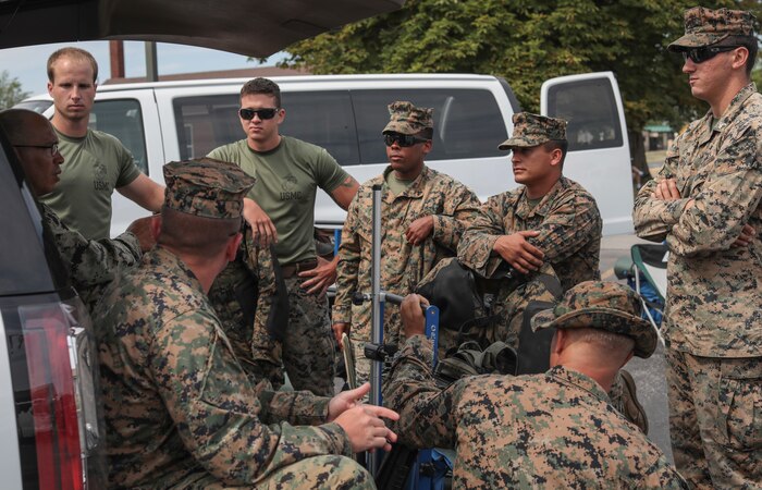 Marines with the Marine Corps Recruit Depot Parris Island Shooting Team, discuss their plan of attack before the Infantry Trophy Team Match at Camp Perry, Ohio August 2, 2018. The National Trophy Rifle Matches are an annual sporting festival established by congress and President Roosevelt in 1903.