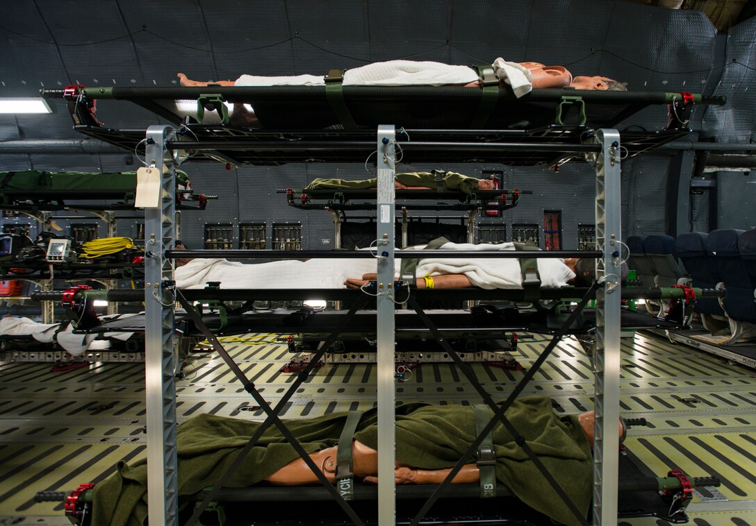 Simulated patients lay on beds during Exercise Ultimate Caduceus 2018 on a C-5M Super Galaxy at Travis Air Force Base, California, Aug. 23, 2018. Ultimate Caduceus 2018 is an annual patient movement exercise designed to test the ability of U.S. Transportation Command to provide medical evacuation. (U.S. Air Force photo by Staff Sgt. Daniel Phelps)