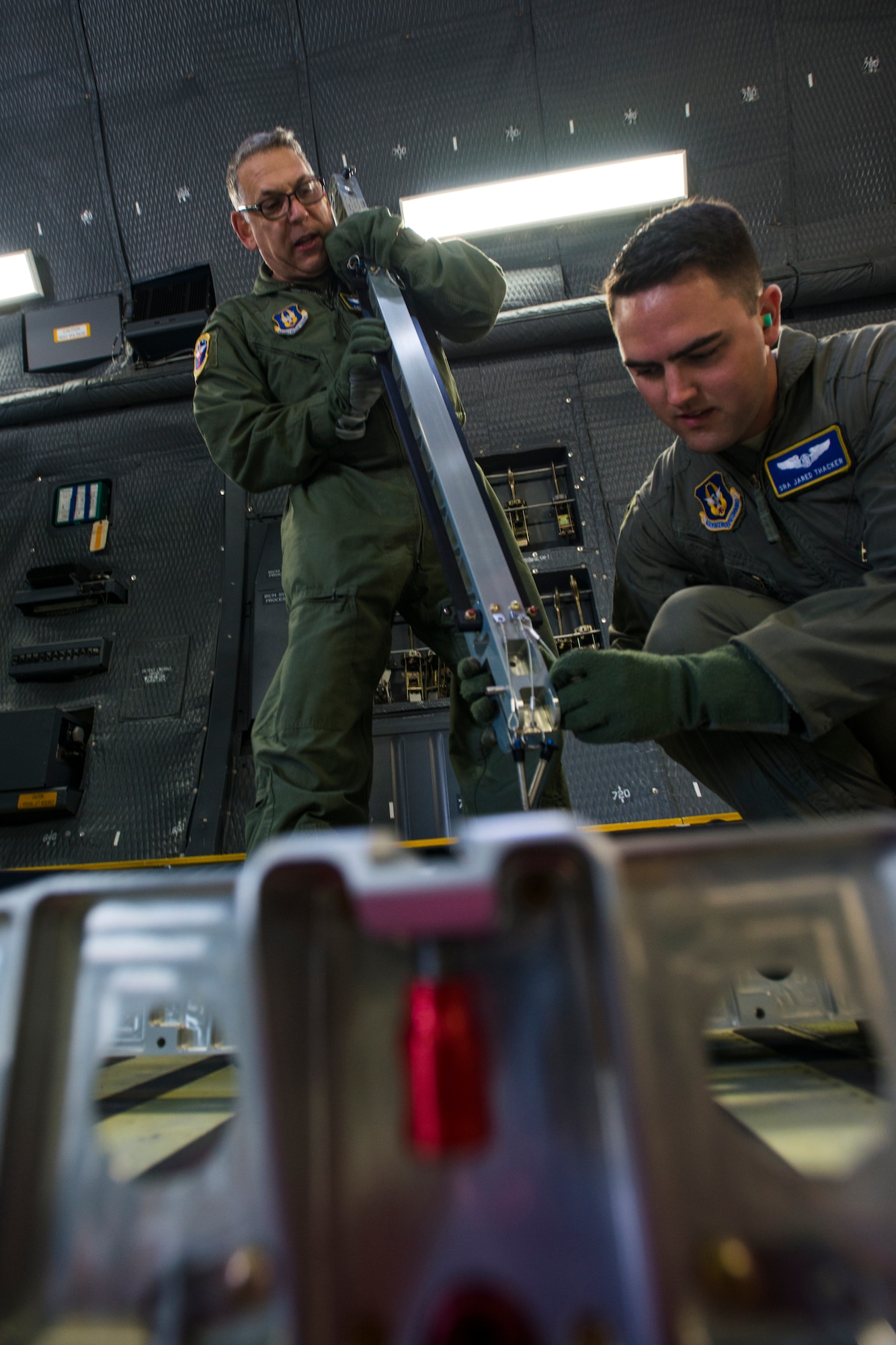 U.S. Air Force Lt. Col. David Rodberg, 94th Aeromedical Evacuation Squadron operations flight commander, and Senior Airman James Thacker, 445th Aeromedical Evacuation Squadron medical technician, put together patient beds in a C-5M Super Galaxy, prepping it for simulated patients during Exercise Ultimate Caduceus 2018 at Travis Air Force Base, California, Aug. 23, 2018. Ultimate Caduceus 2018 is an annual patient movement exercise designed to test the ability of U.S. Transportation Command to provide medical evacuation. (U.S. Air Force photo by Staff Sgt. Daniel Phelps)