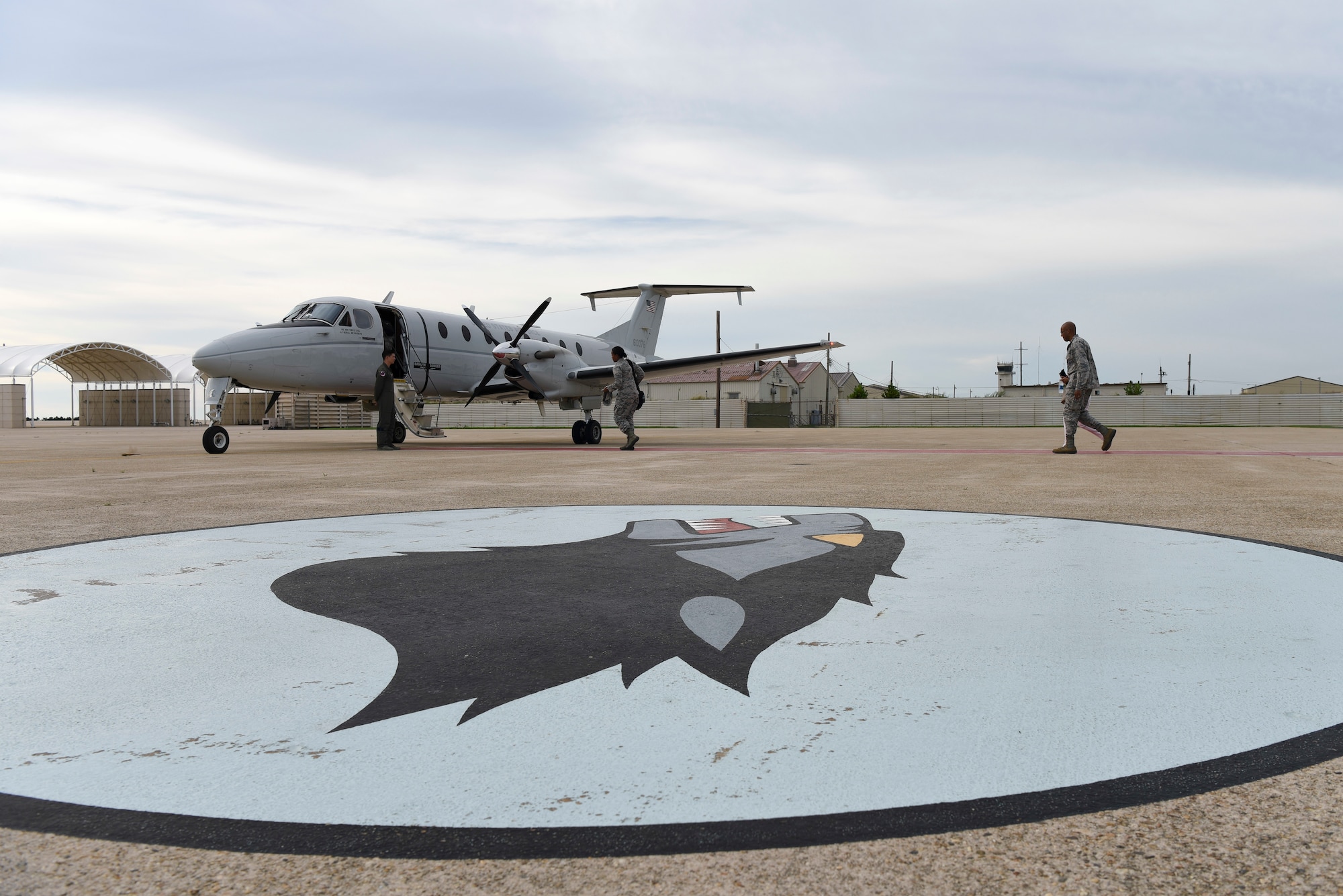 U.S. Air Force Gen. CQ Brown, Jr., Pacific Air Forces commander (right), boards a plane to depart Kunsan Air Base, Republic of Korea, Aug. 29, 2018. Brown, a former 35th Fighter Squadron pilot and Kunsan wing commander, affectionately known as the “Wolf,” toured the 8th Fighter Wing, meeting with Airmen and learning about the base’s current overall mission capabilities. (U.S. Air Force photo by Senior Airman Savannah L. Waters)