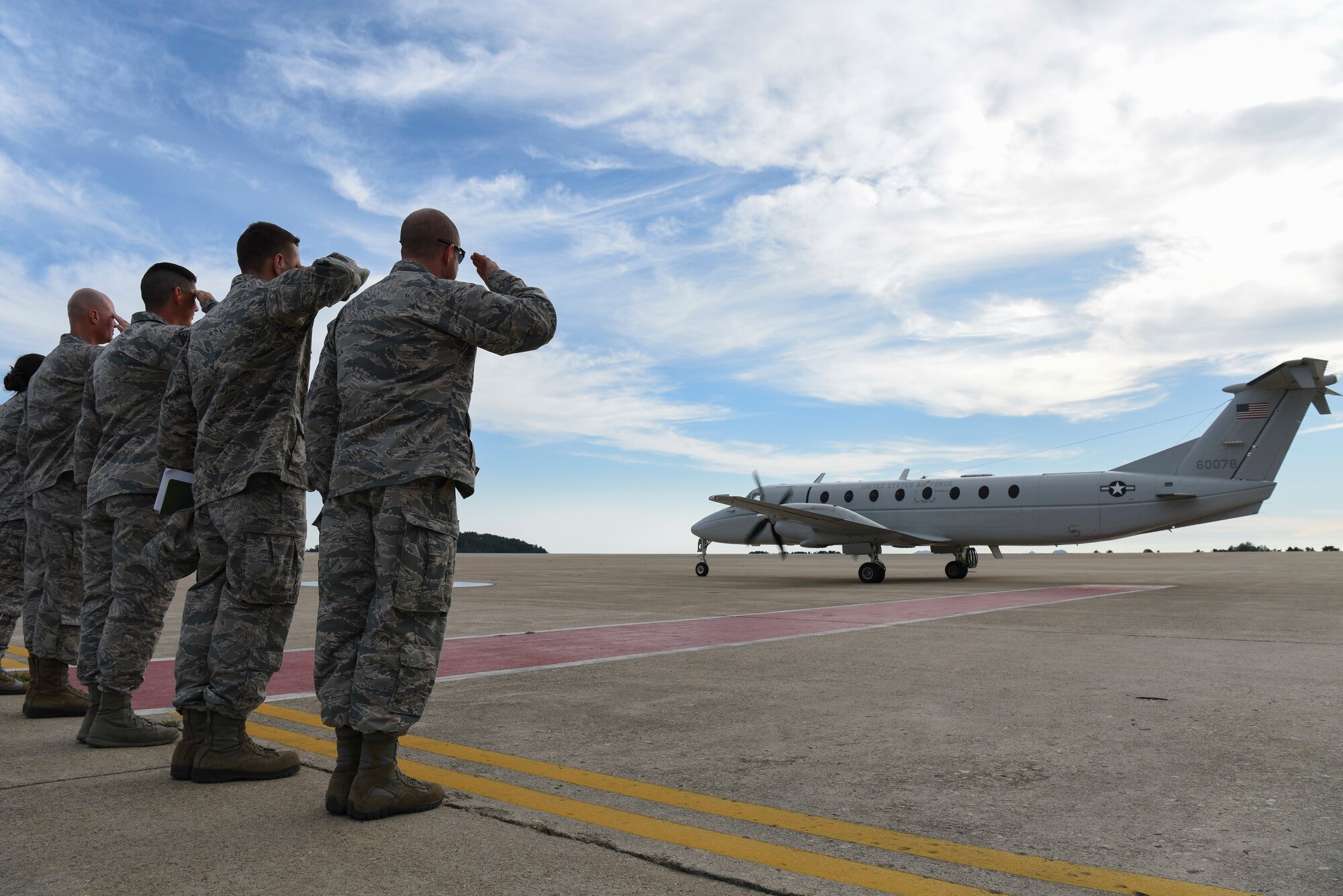 U.S. Air Force Col. John Bosone, 8th Fighter Wing commander or “Wolf 58” (right), and 8th Fighter Wing Airmen salute Gen. CQ Brown, Jr., Pacific Air Forces commander, during his departure from Kunsan Air Base, Republic of Korea, Aug. 29, 2018. Brown, a former 35th Fighter Squadron pilot and Kunsan wing commander, then-called “Wolf 46” toured the 8th Fighter Wing, meeting with Airmen and learning about the base’s current overall mission capabilities. (U.S. Air Force photo by Senior Airman Savannah L. Waters)